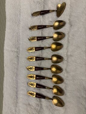 Set of eight vintage Siam Buddha brass and wood teaspoons and one jelly spoon